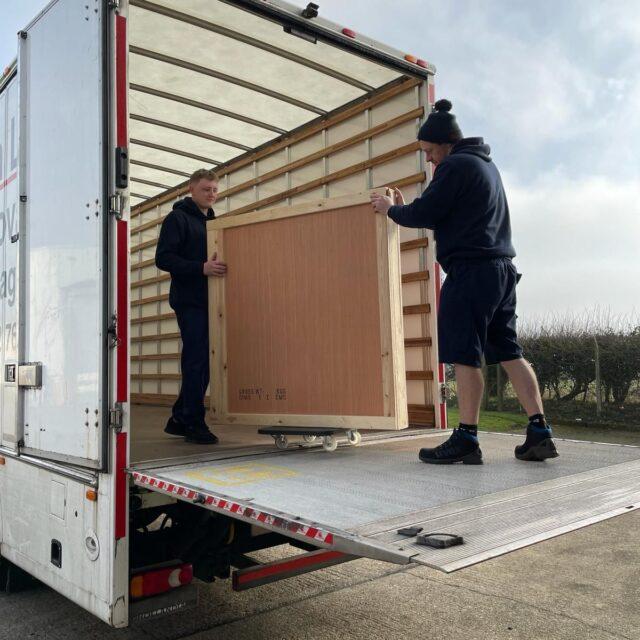 Each Art Unique staff unloading truck.